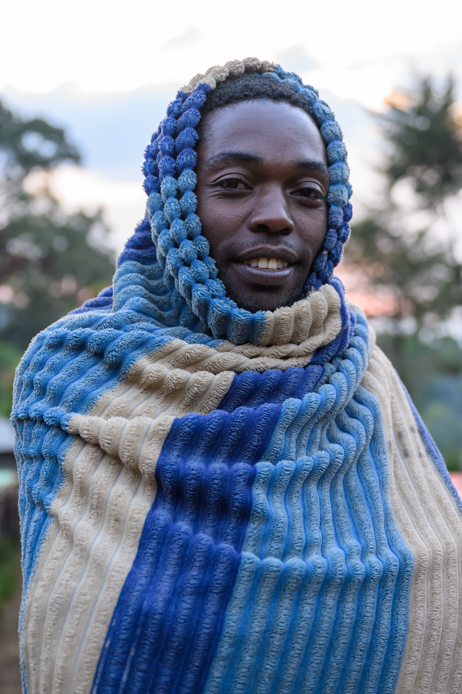 Picker wrapped in a blanket at dawn