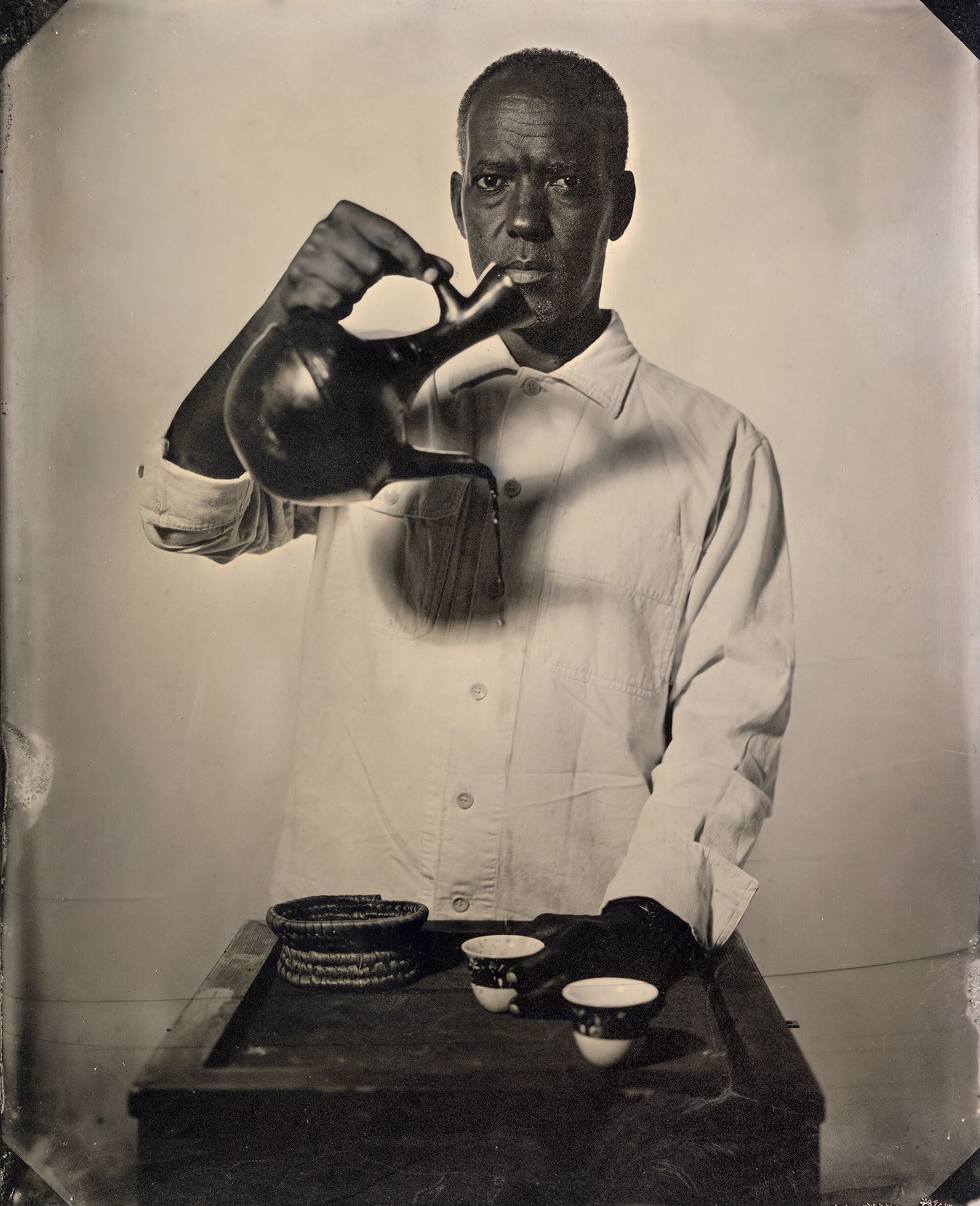 Eyakem Gulilat pouring coffee from a jebena, wet-plate portrait