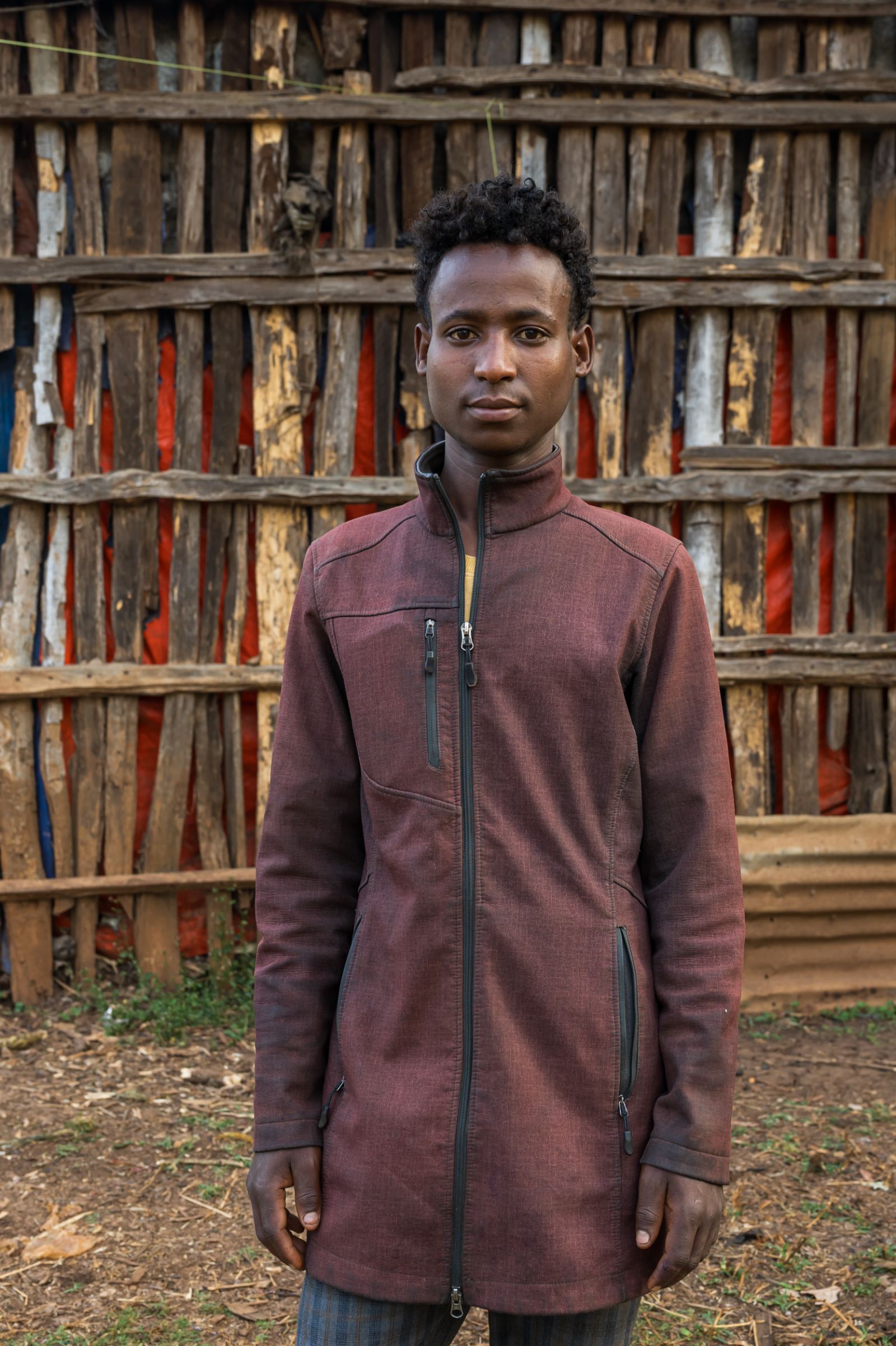 Young picker in a maroon jacket